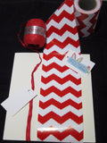 Red raffia ribbon, white gift tag and red belly band wrap
